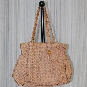 The Sak Beige Woven Shoulder Bag.
